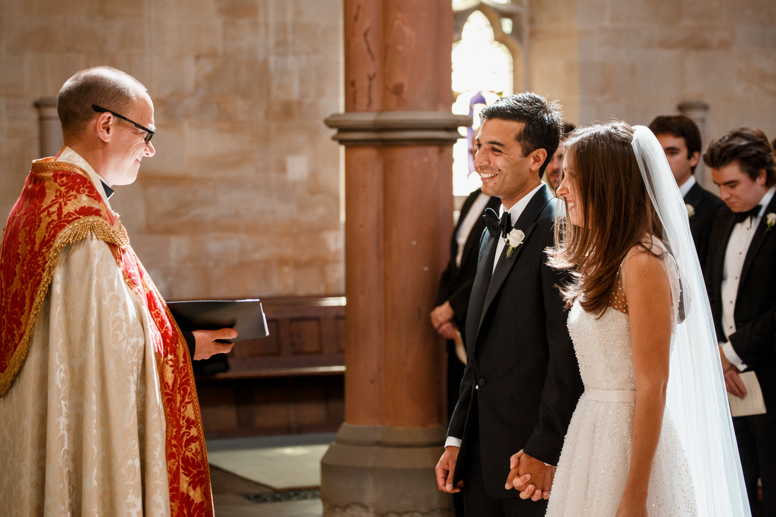 bride and groom at wedding altar in cotswolds wedding