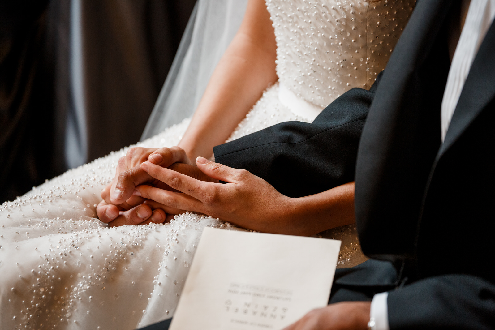 bride and groom holding hands