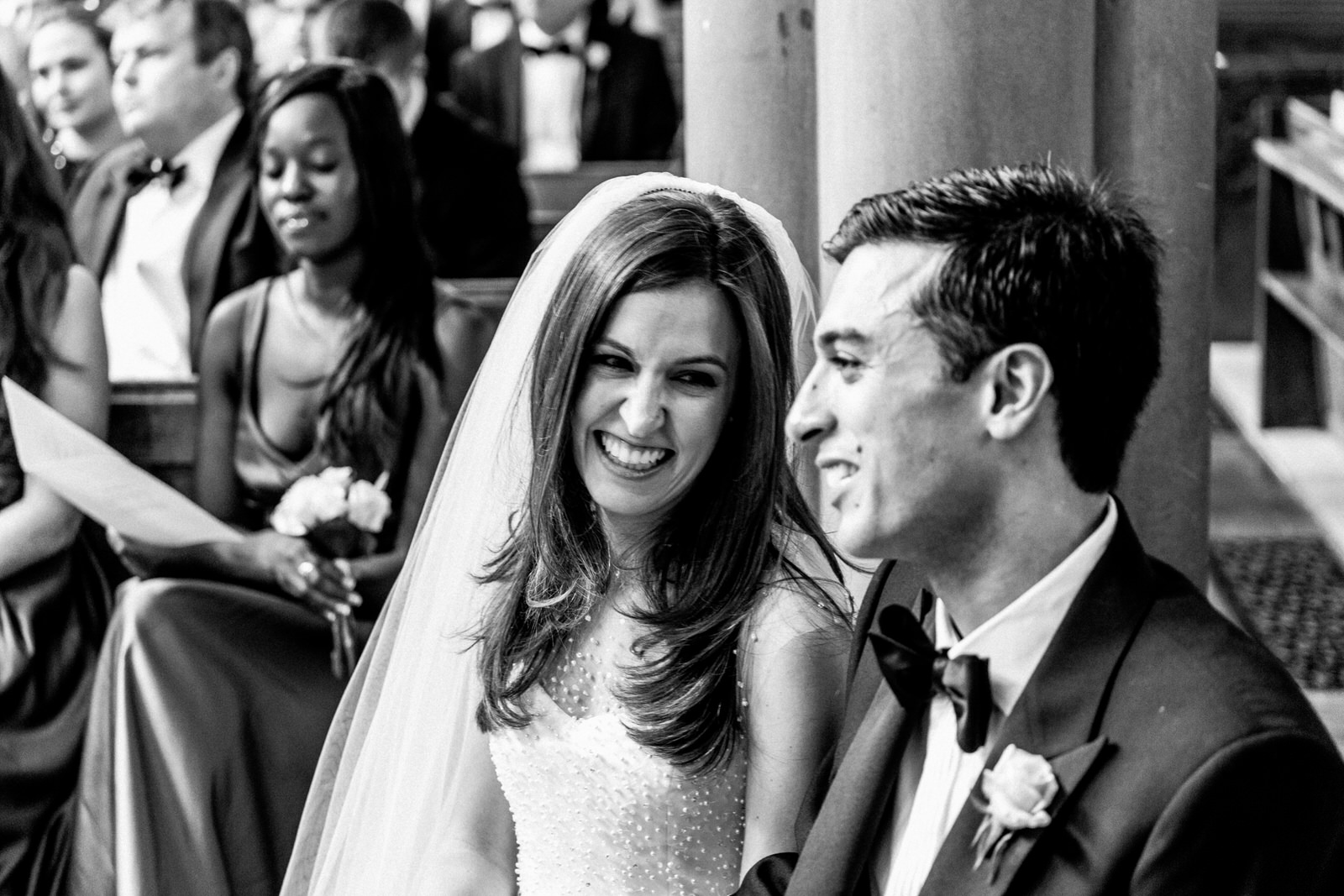 bride and groom exchanging glances at wedding