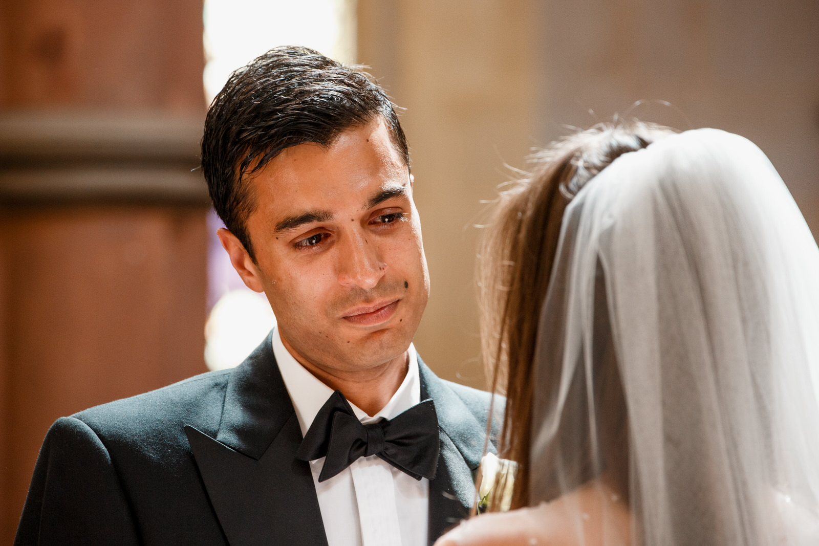 groom looking at bride