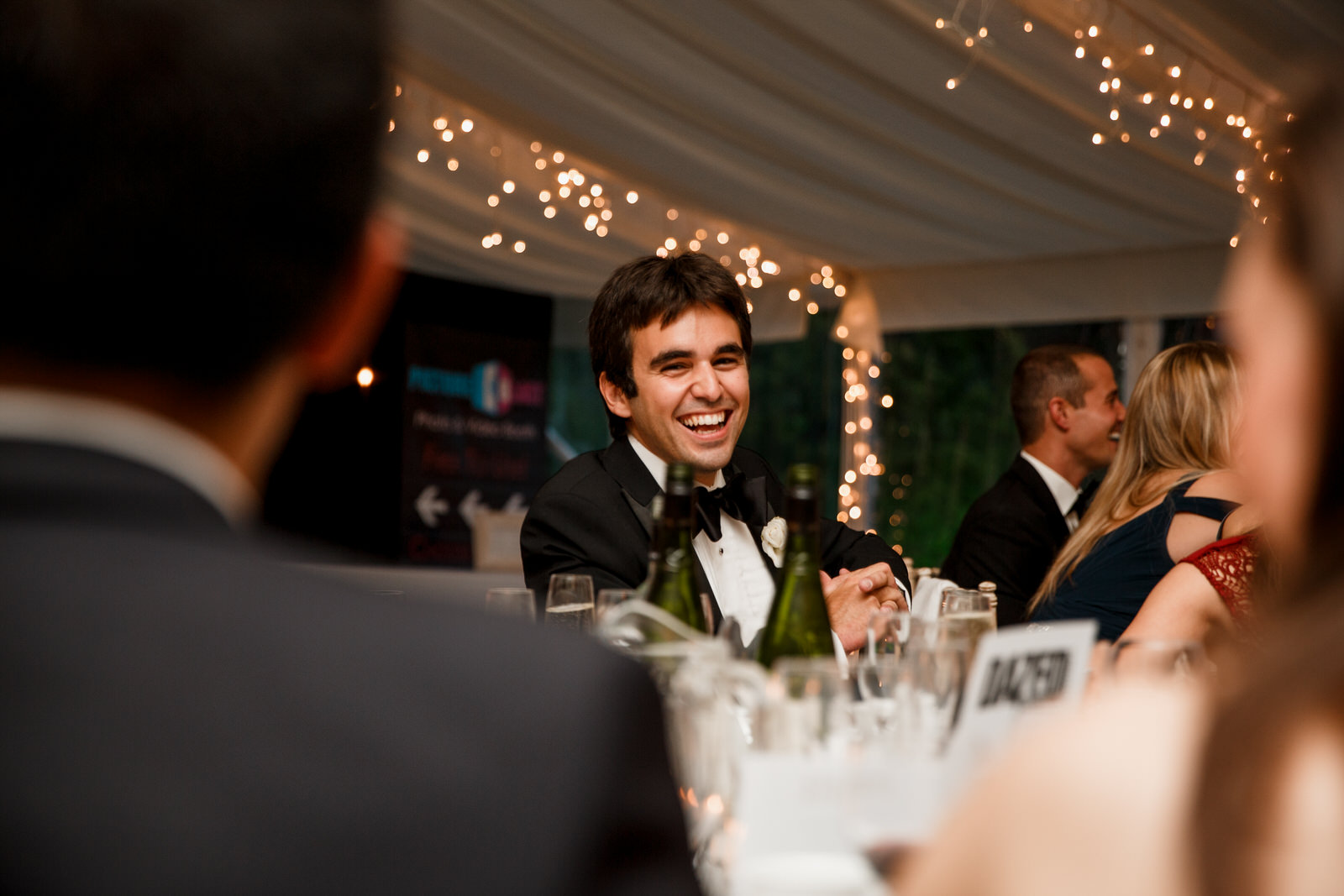 laughs at the speeches at wedding day