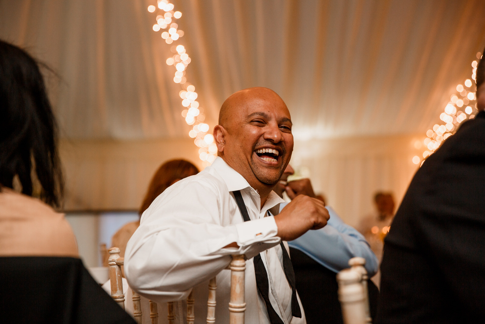 middle stanley wedding guest laughing