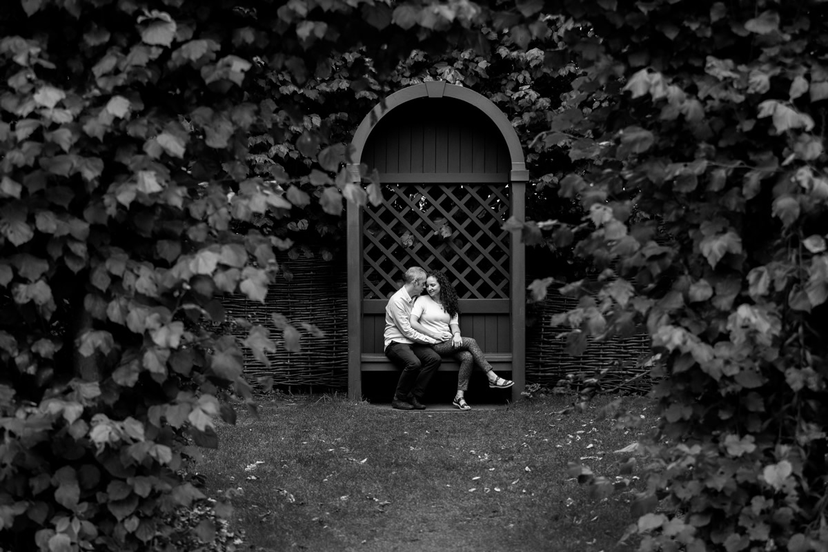 couple sharing quiet moment on seat in regents park
