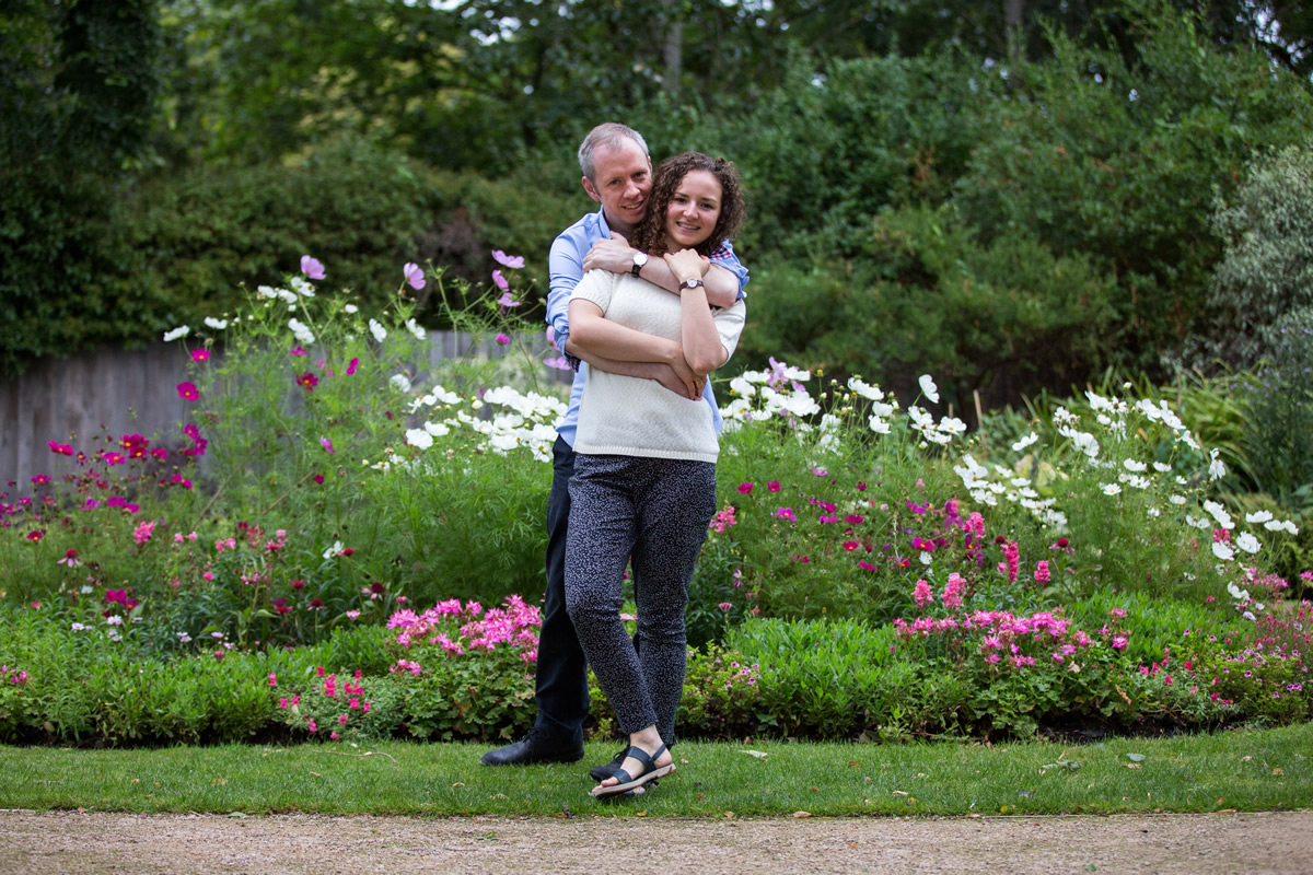 couple cuddling for engagement shoot