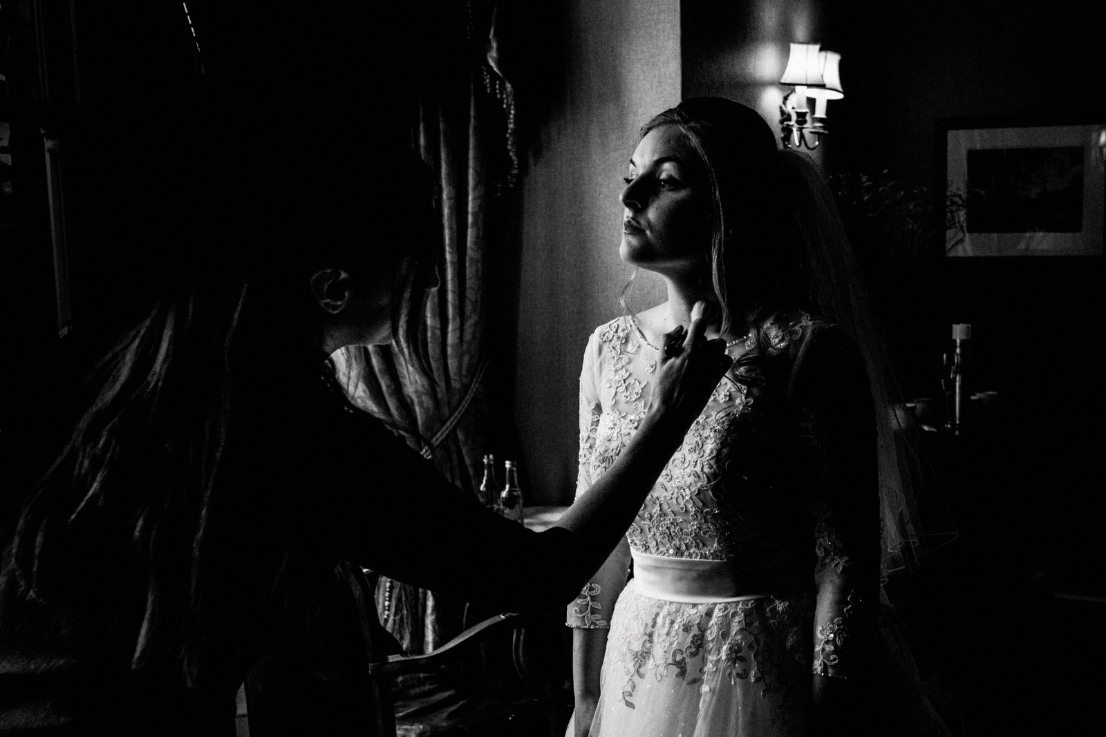 bride having perfume applied