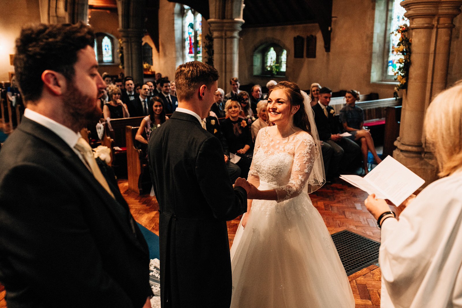 bride and groom at altar
