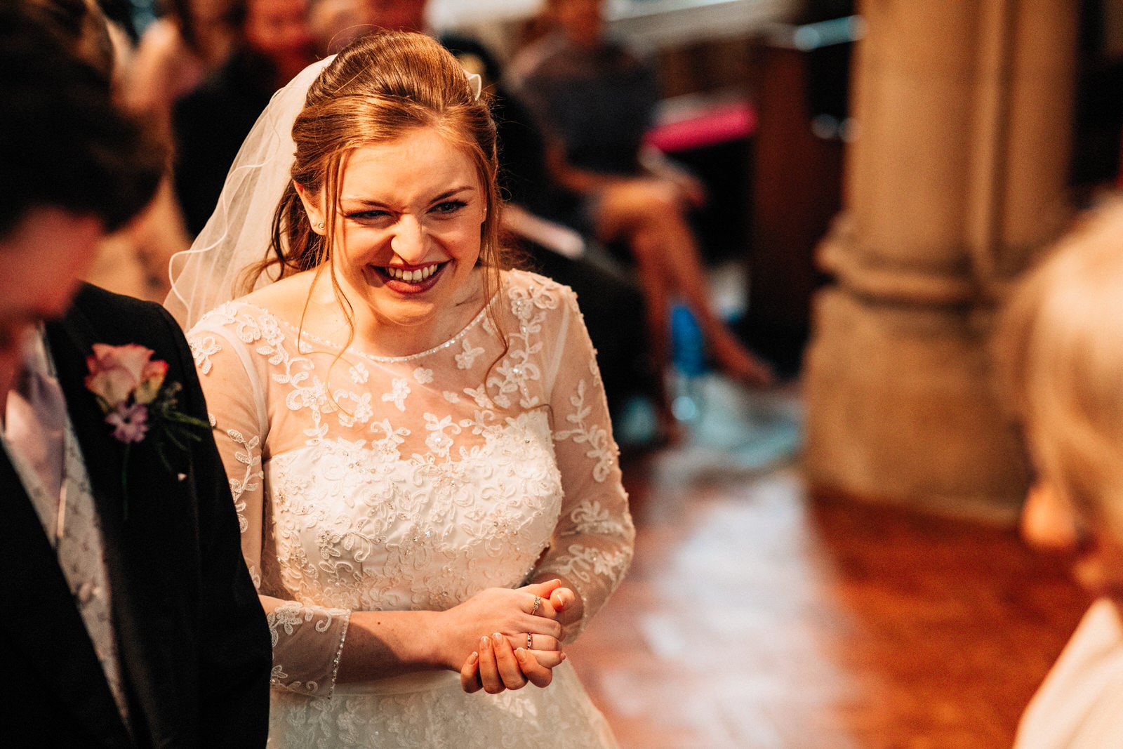 bride laughing in church