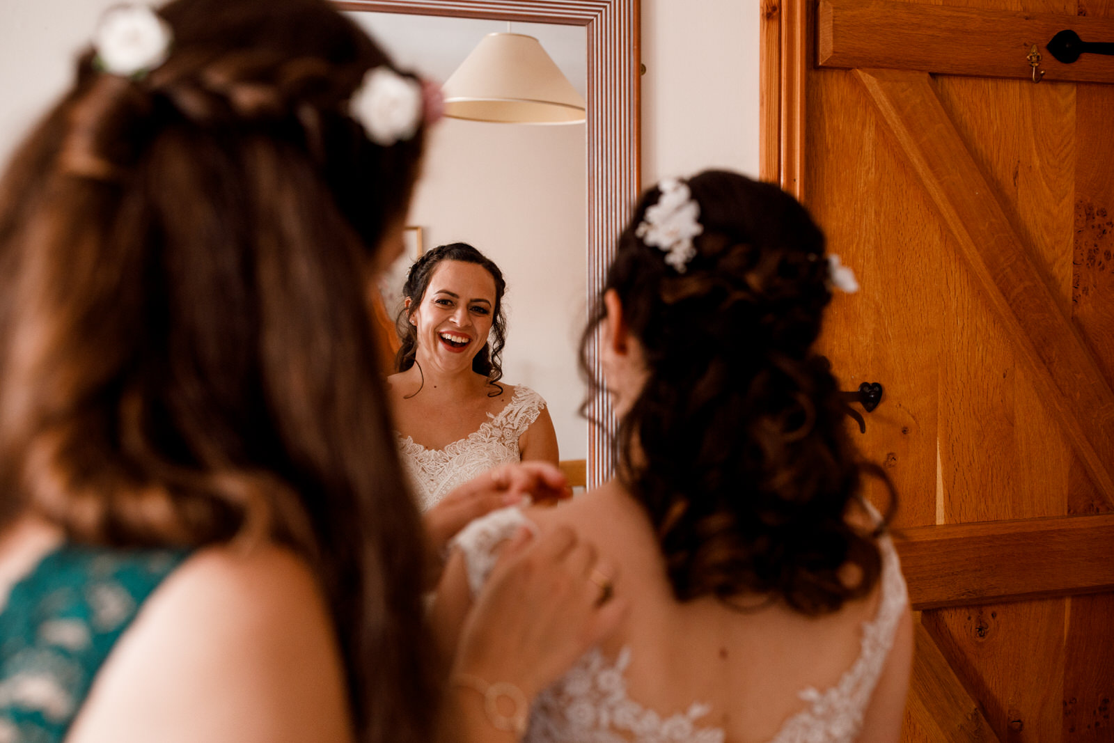 bride and sister getting ready at wedding