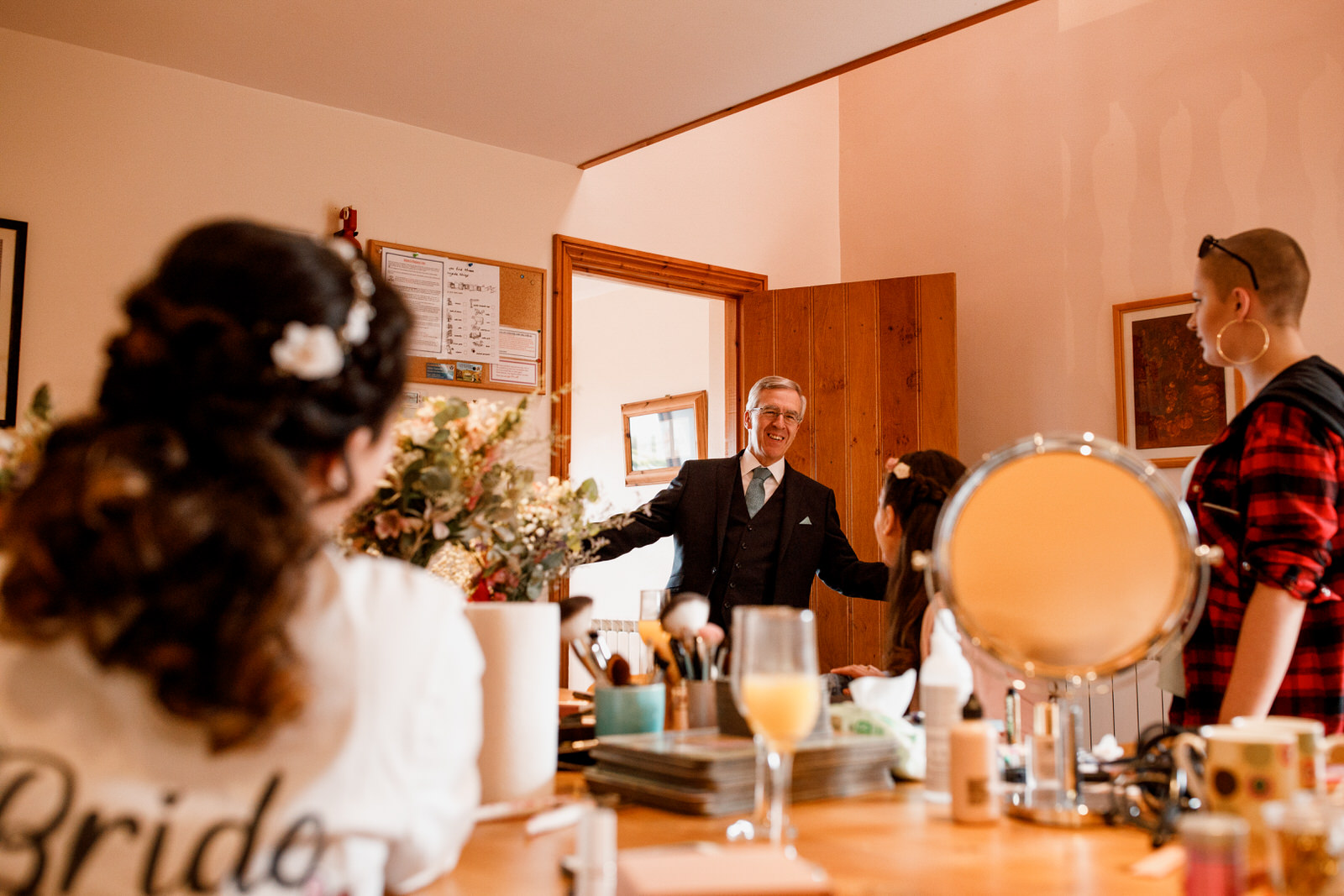 father checking on bride