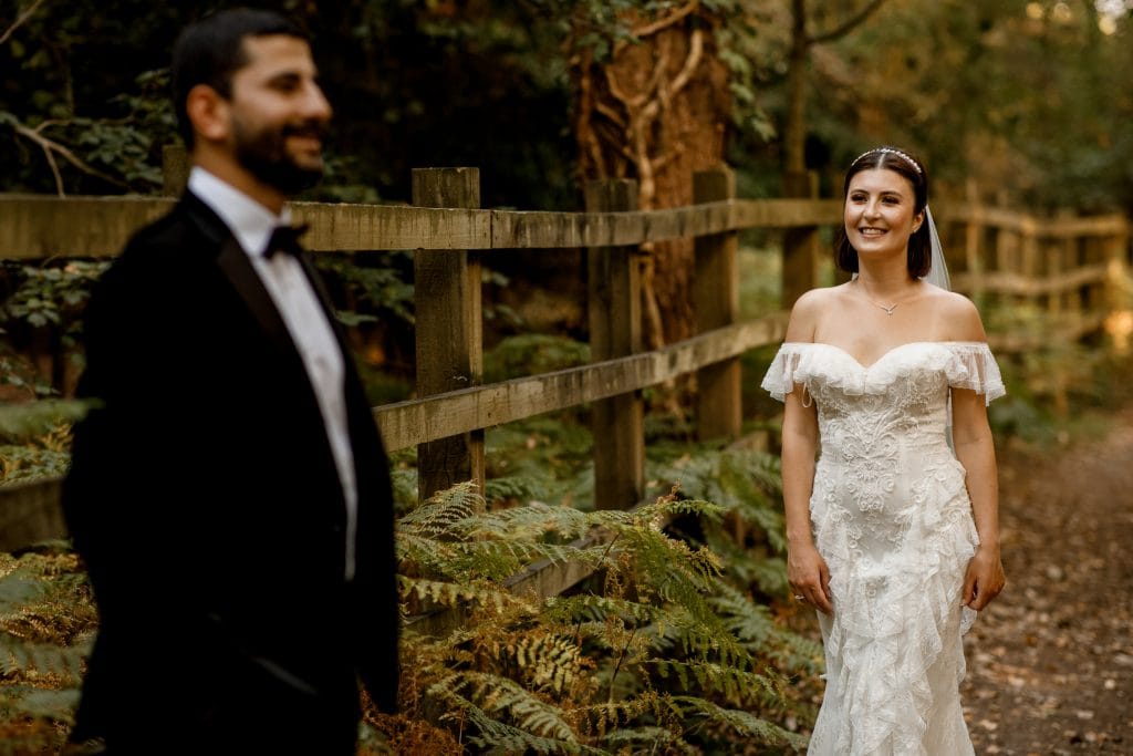 bride looking at groom in burnham beeches
