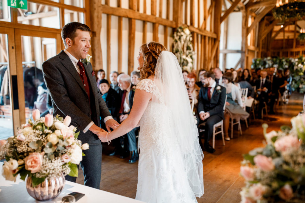 bride and groom at altar