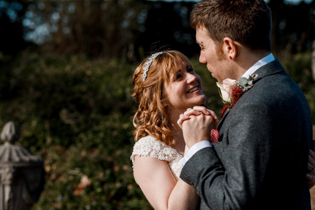 bride and groom in gardens of micklefield hall