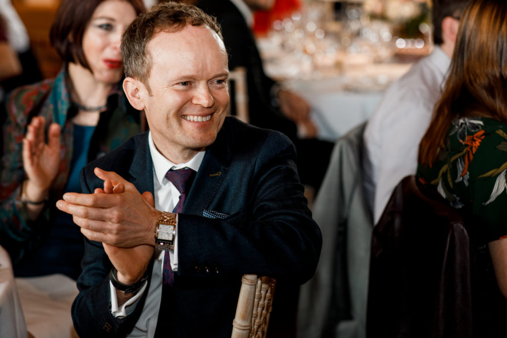 guest laughing at wedding day speech