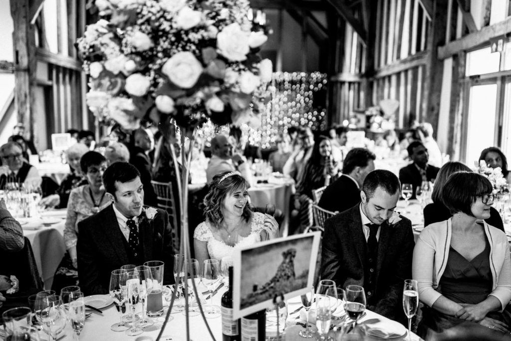 bride and groom enjoying father of the bride speech