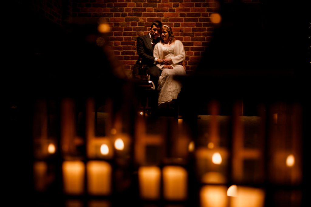 candle lit bride and groom