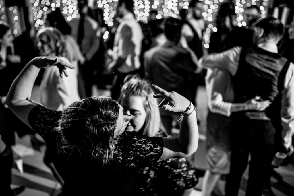 guests partying with hands in air