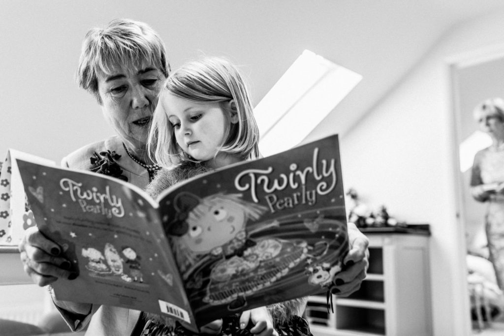 grandma reading to grandaughter