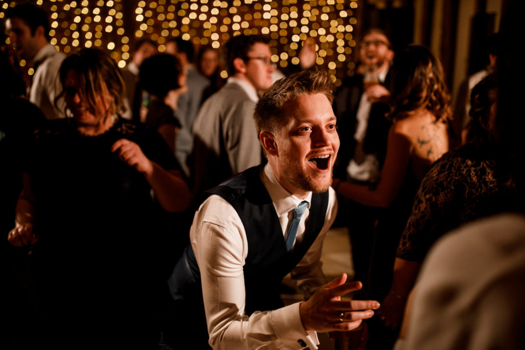 guest laughing on dance floor at micklefield hall wedding