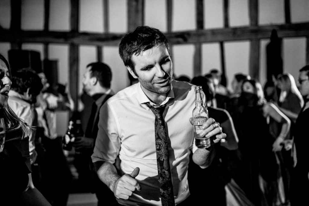 male guest at wedding dancing
