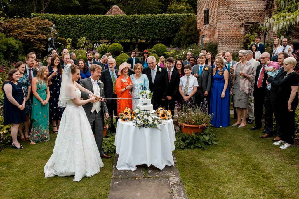 cake cutting at chenies manor house wedding