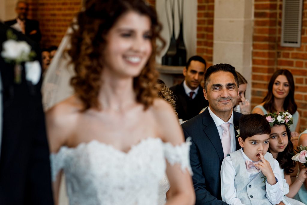 dad looking at bride