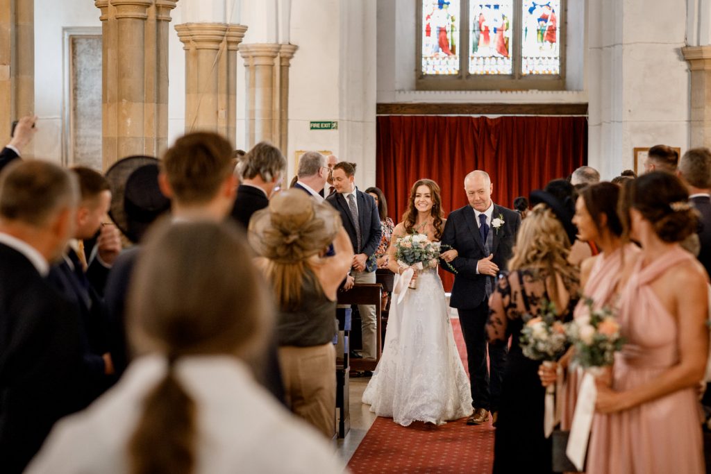 bride walking down aisle in amersham church