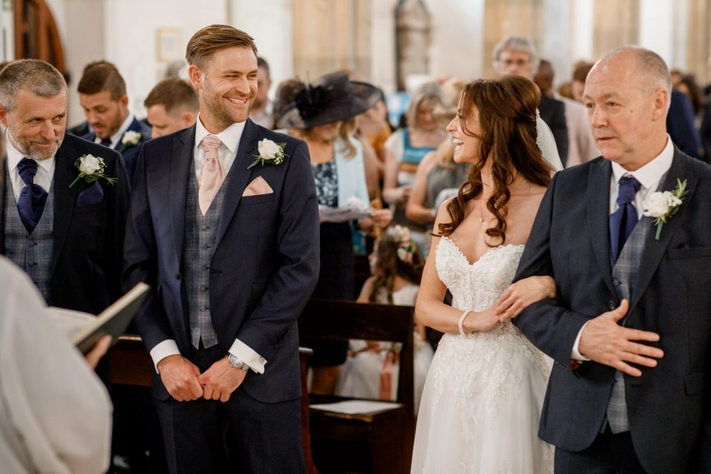 groom seeing bride for the first time at kings chapel wedding