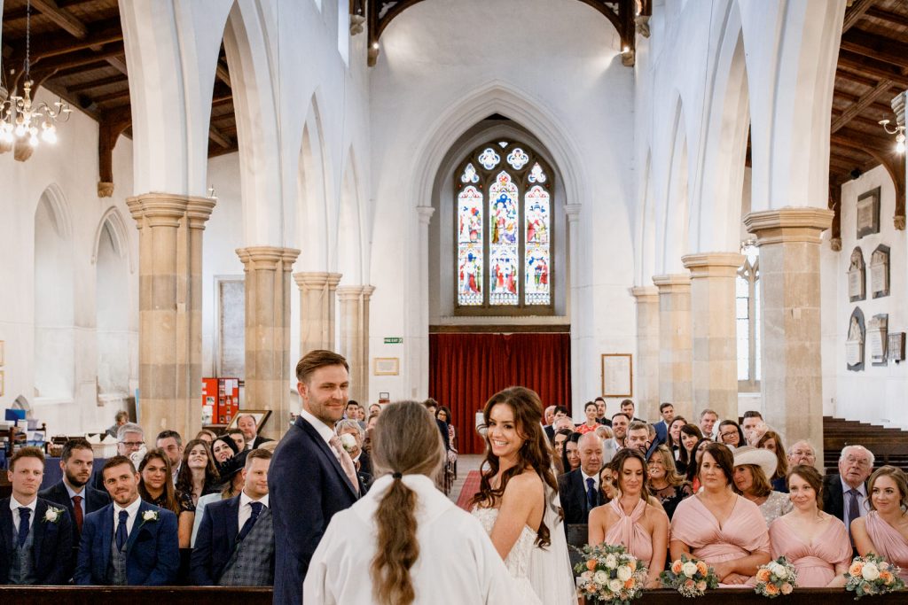 bride and groom at altar for kings chapel wedding