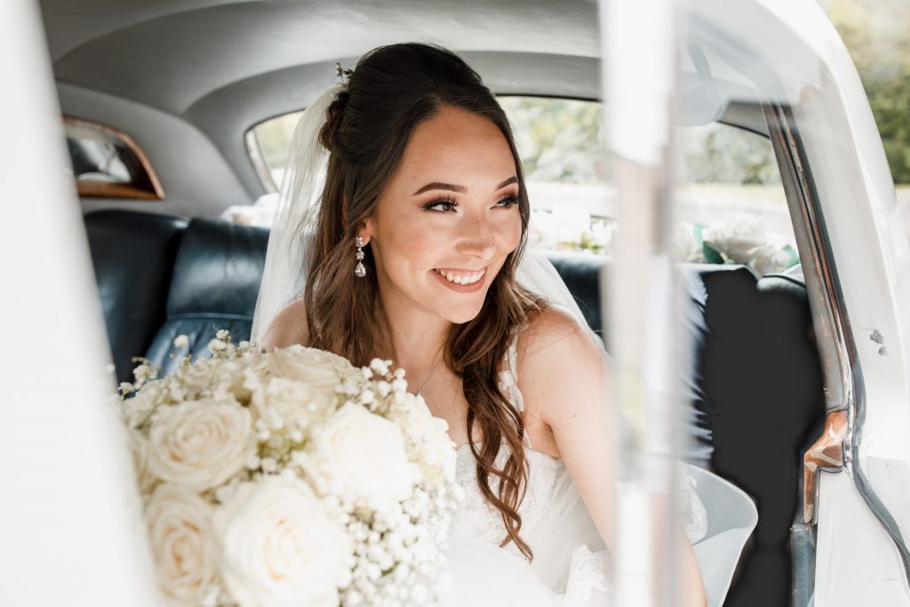 bride in bridal car