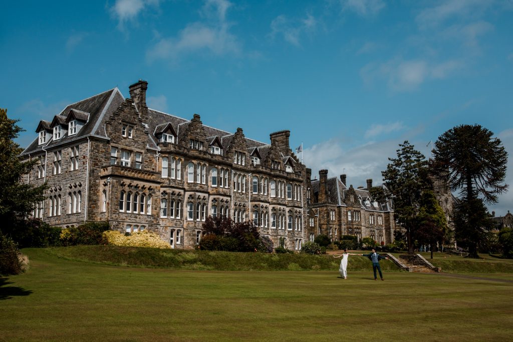 bride and groom in gardns at ashdown park hotel