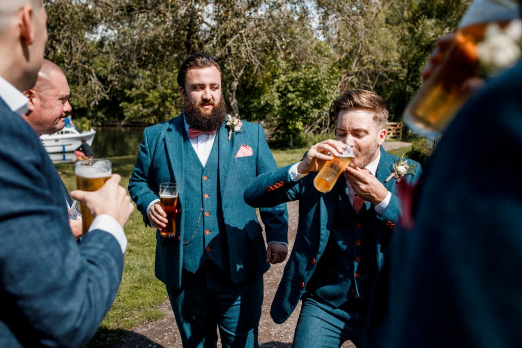 groom and best man having a beer