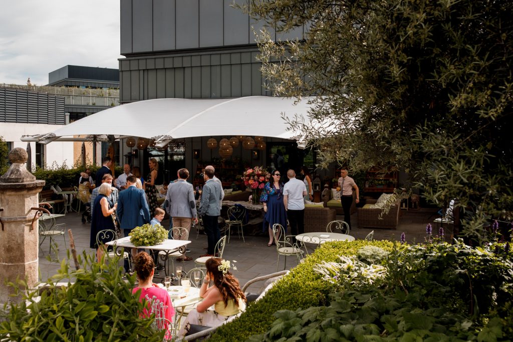 guests on roof garden at ham yard hotel wedding