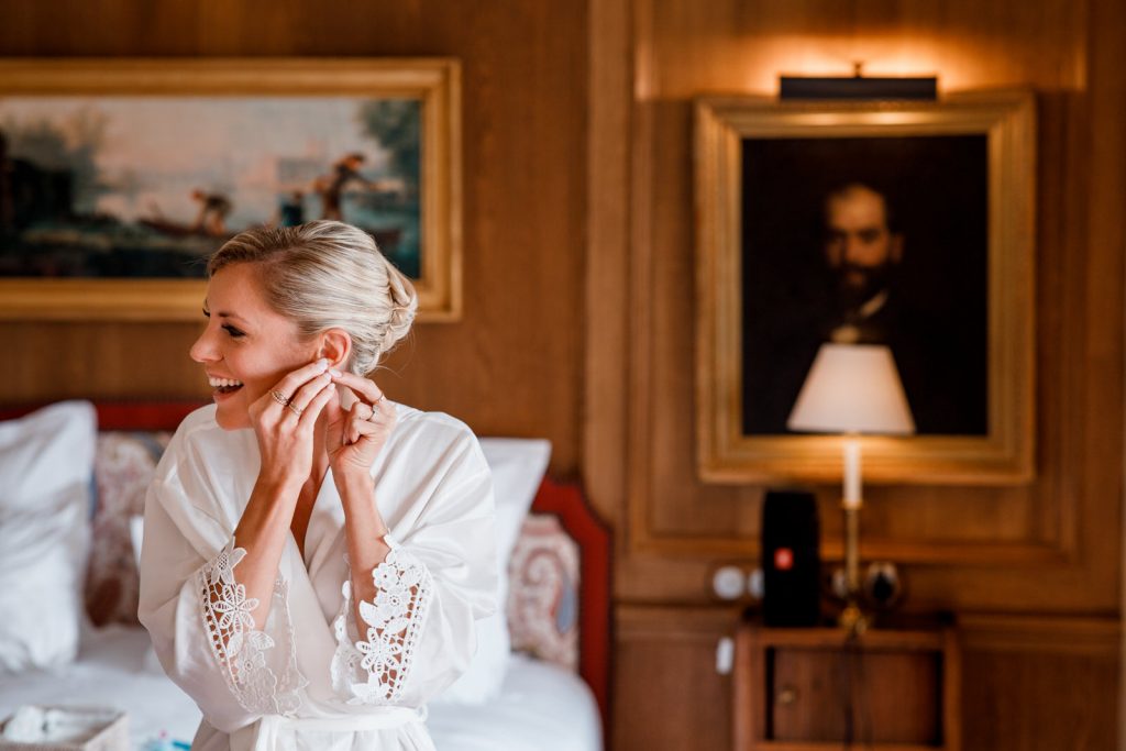 bride putting on earings