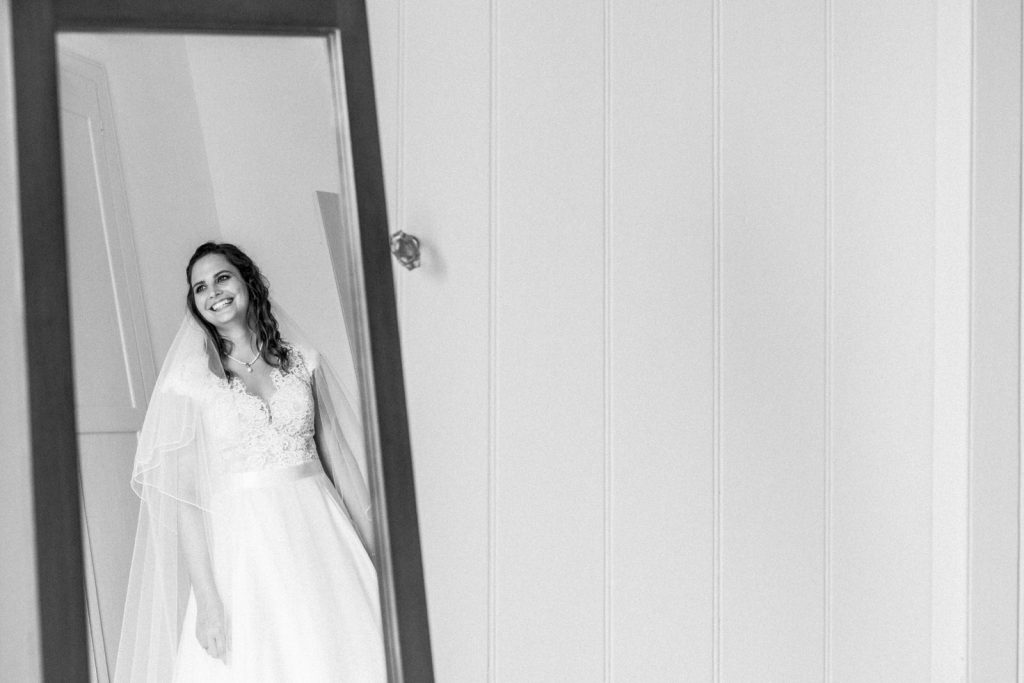 bride reflection in mirror wearing wedding dress