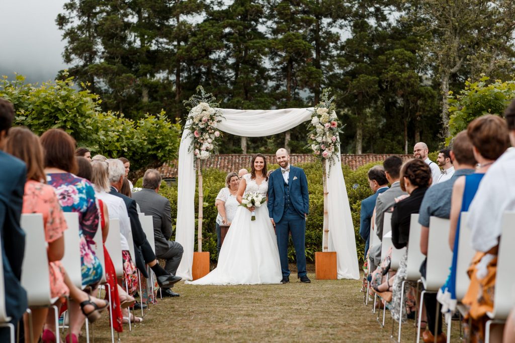 bride and groom at altar in garden wedding