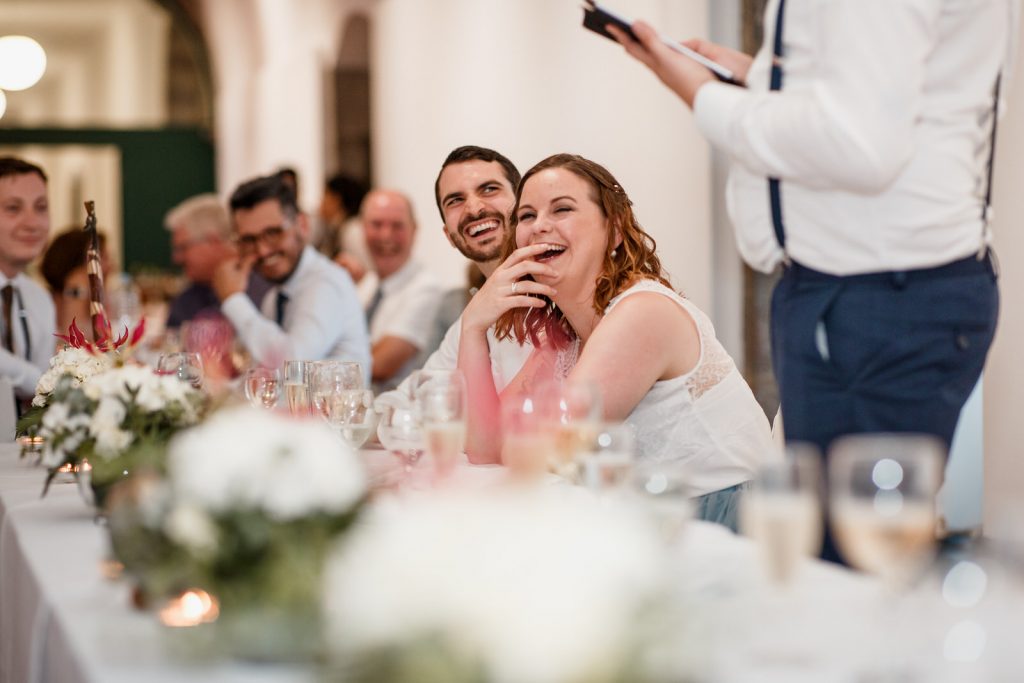 guests laughing at speeches