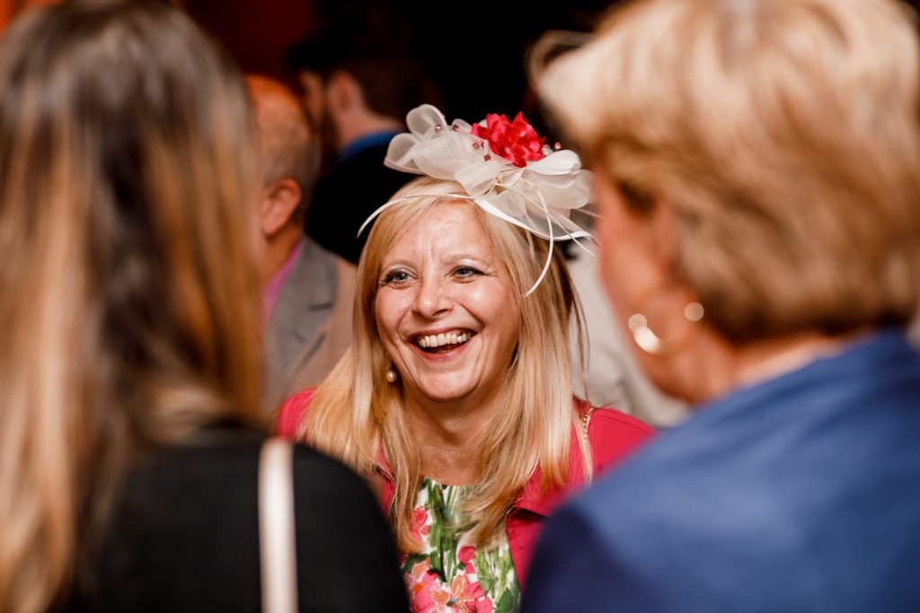 guests laughing at london wedding reception