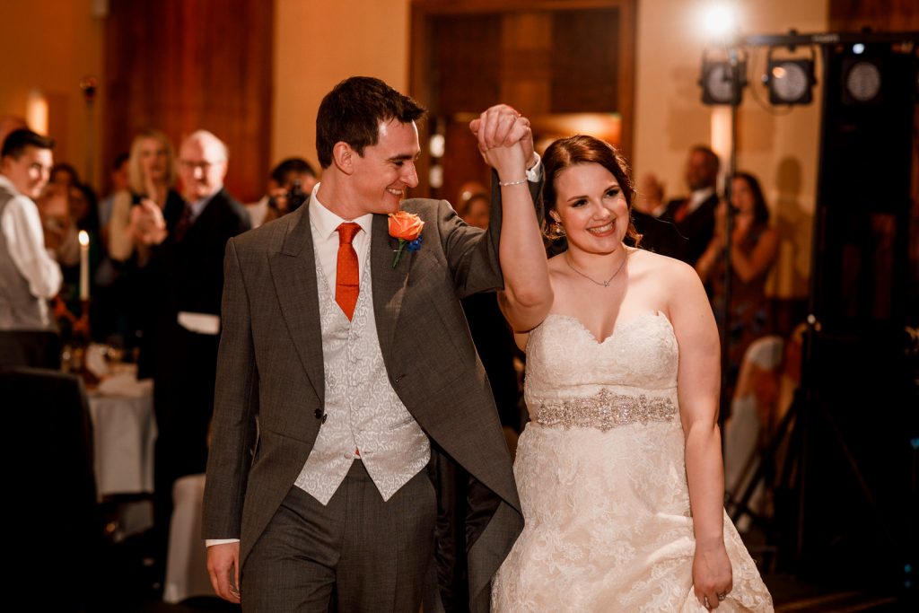 bride and groom entering wedding breakfast