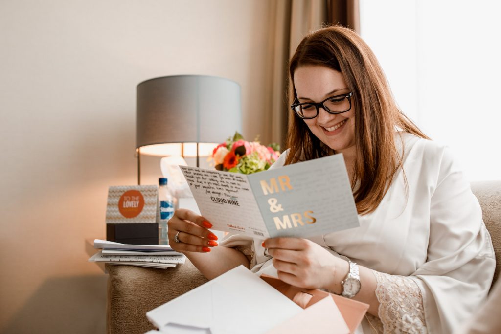 bride reading wedding card