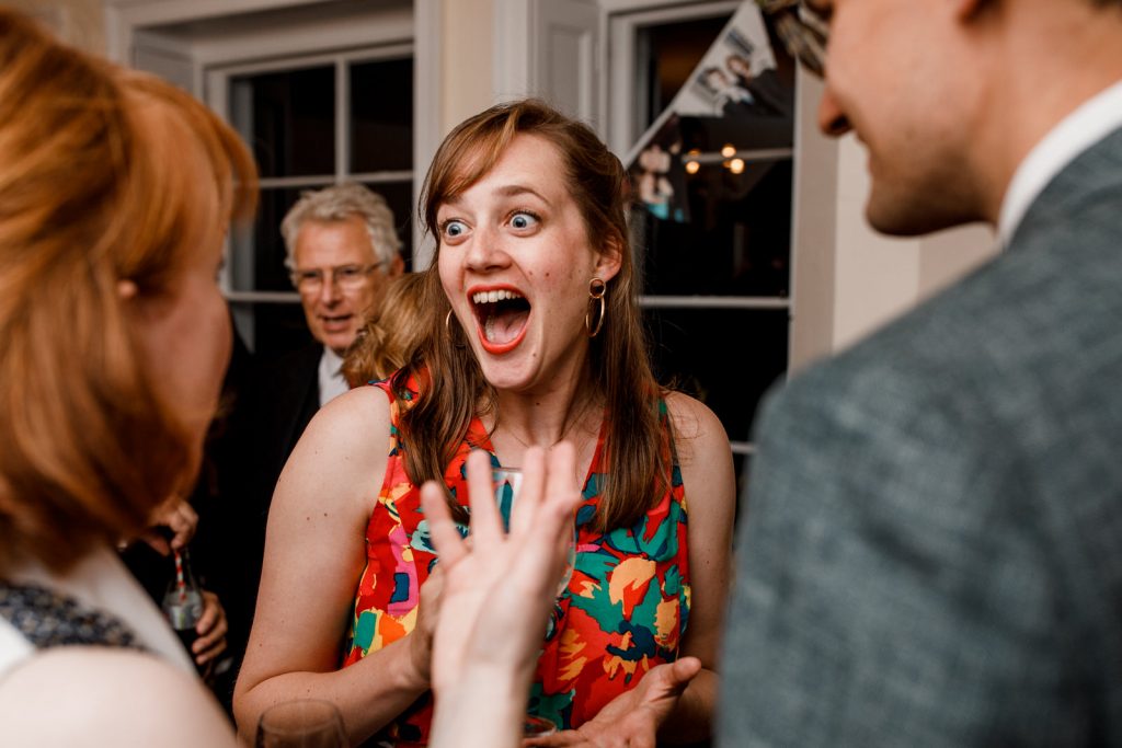 guest laughing on dancefloor of wedding