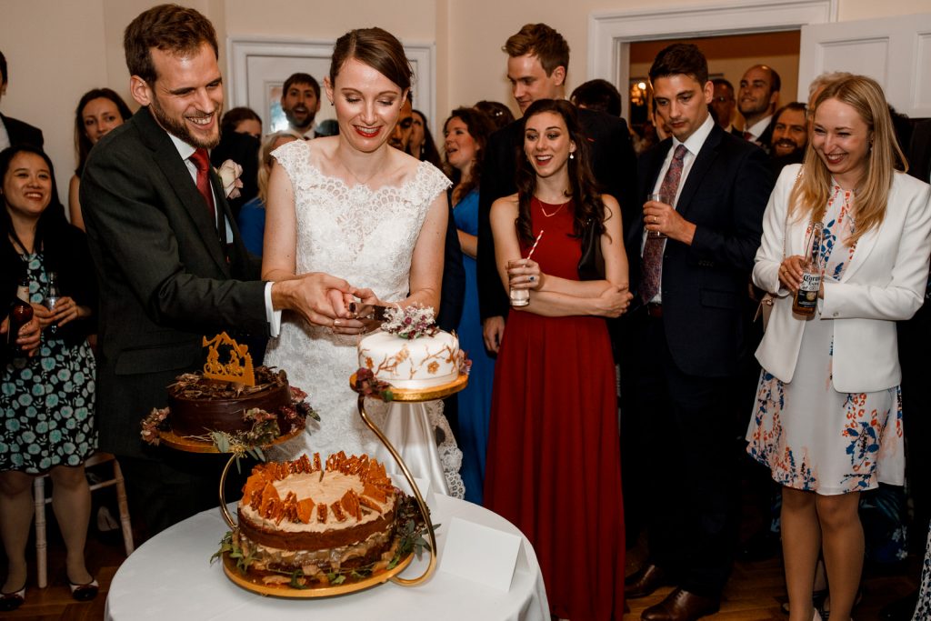 wedding cake cut at richmond park wedding