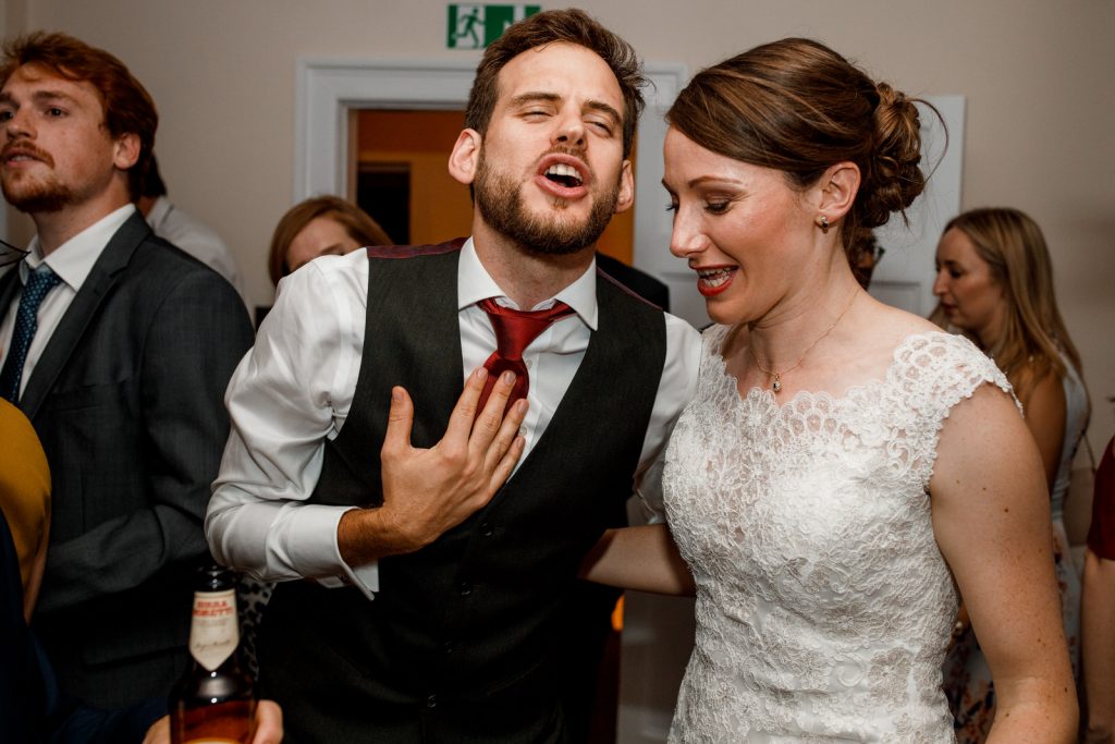 bride and groom dancing on floor at wedding