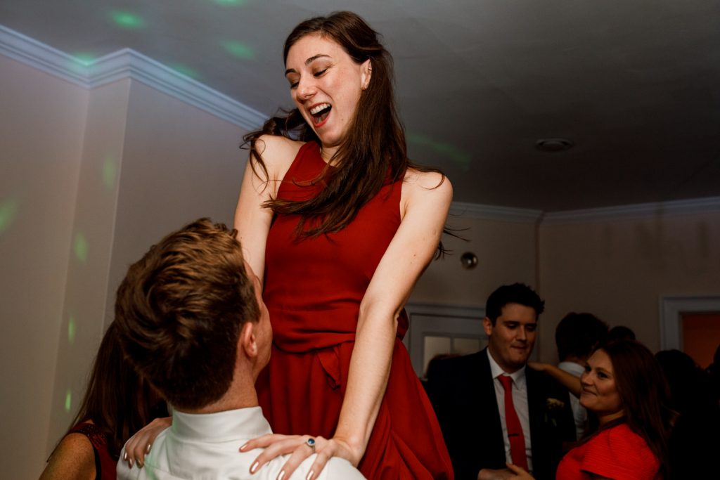 guest being lifted up in air at pembroke lodge wedding