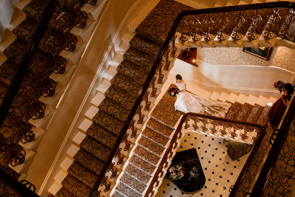 bride leaving down stairs of petersham hotel