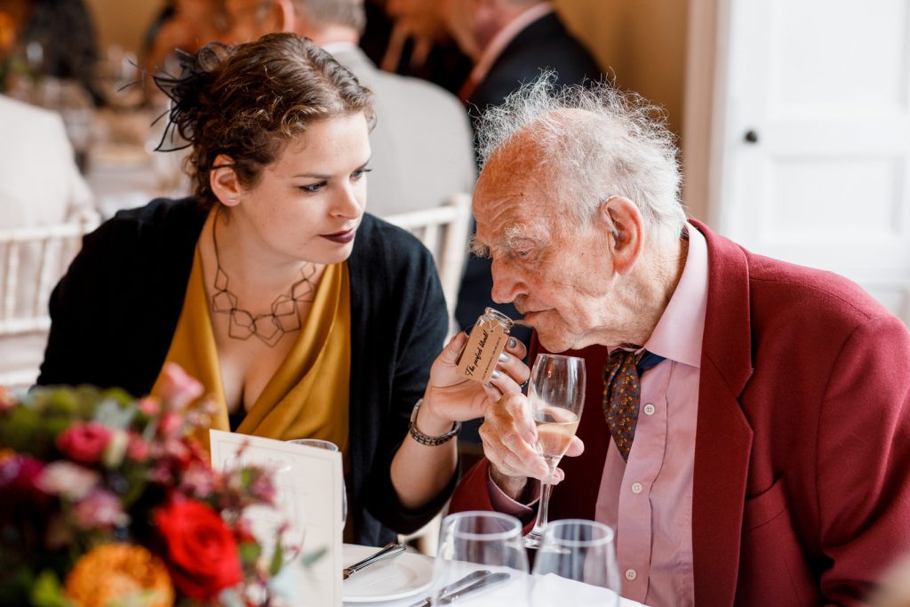 grandad smelling wedding favour