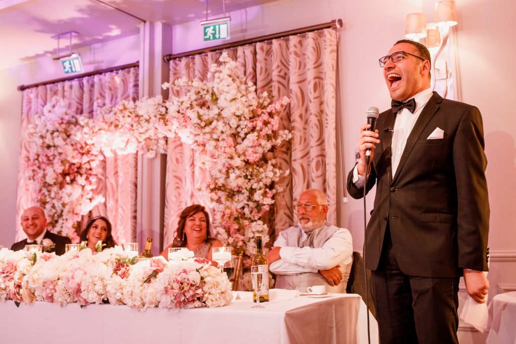best man laughing at speech