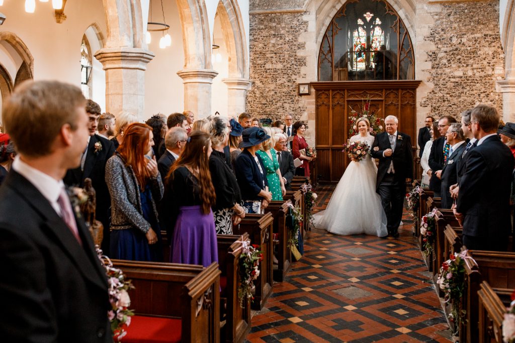 bride walking down aisle at henley wedding
