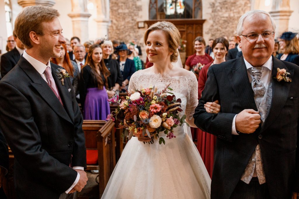 bride meeting groom at front of church in henley
