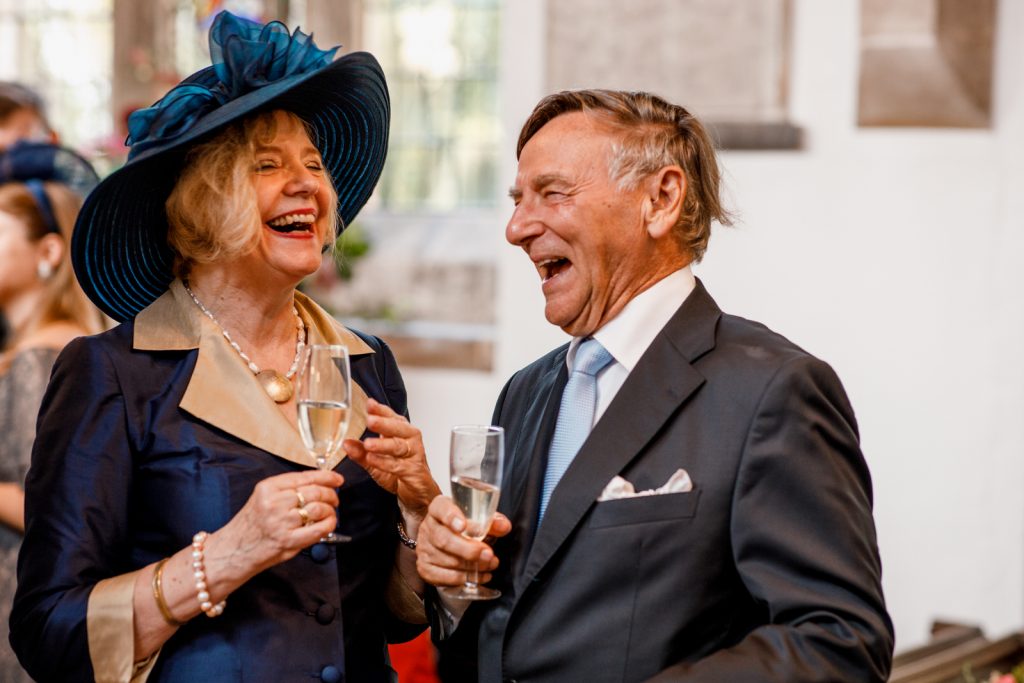guests laughing at wedding