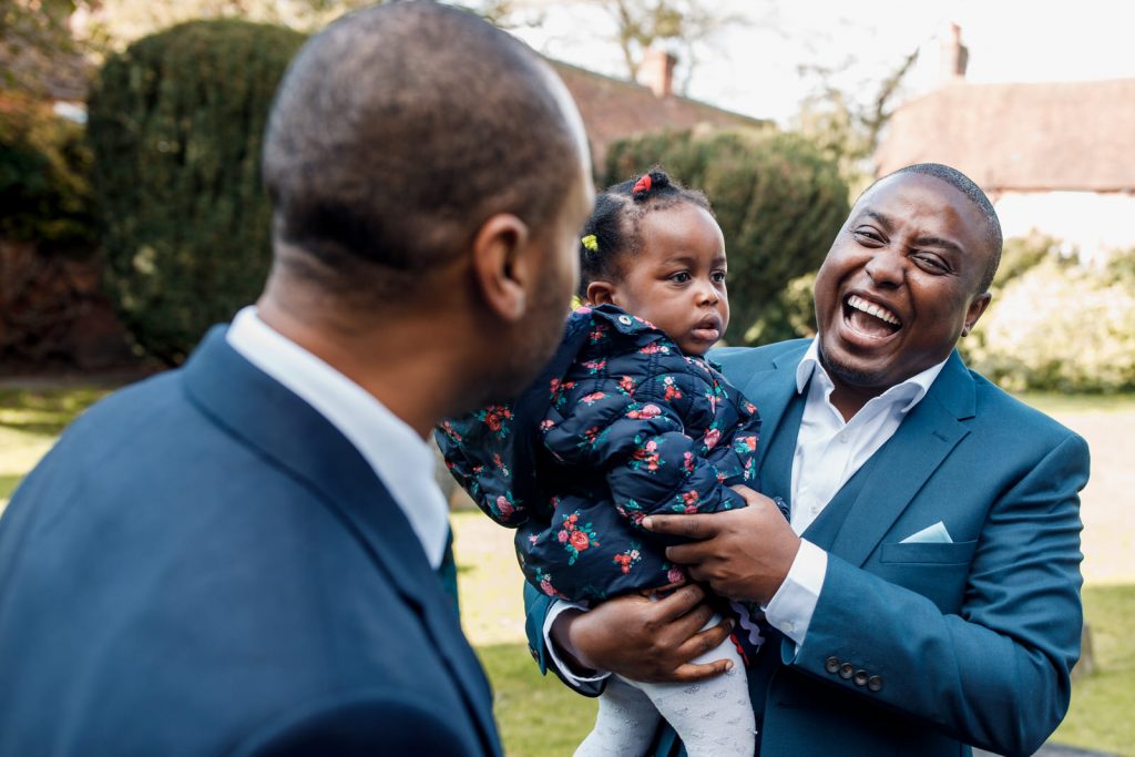 groom greeting guests at beaconsfield church